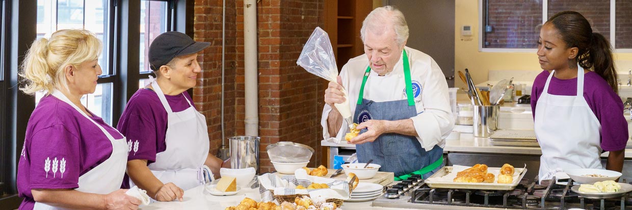 Jacques P&eacute;pin working with culinary students at Hot Bread Kitchen