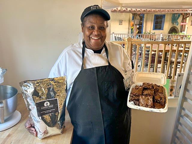 Culinary student holding bag of Scharffen Berger Chocolate