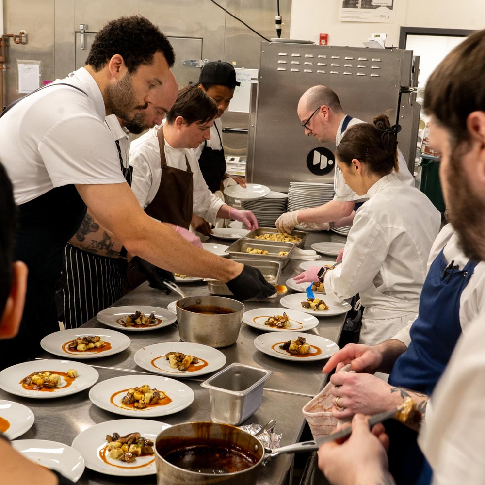 Chefs preparing for 90/90 dinner event at Philabundance Community Kitchen
