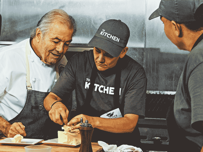 Image of Jacques P&eacute;pin working with culinary student