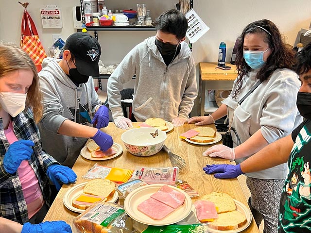 Culinary students working at One Step Beyond kitchen