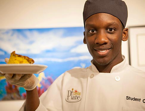 Culinary student holding plate