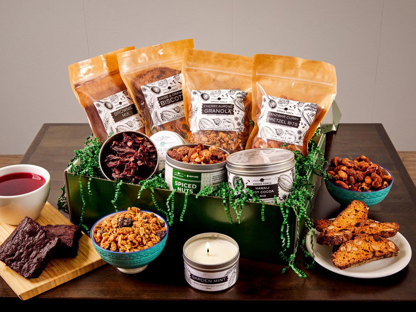 Gift box with granola, nuts, pastry and candles