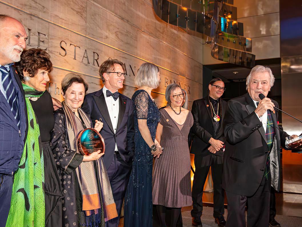 Jacques Pepin standing on stage with Jose Andres, Alice Waters, Sean Sherman and others at the Julia Child Foundation Awards