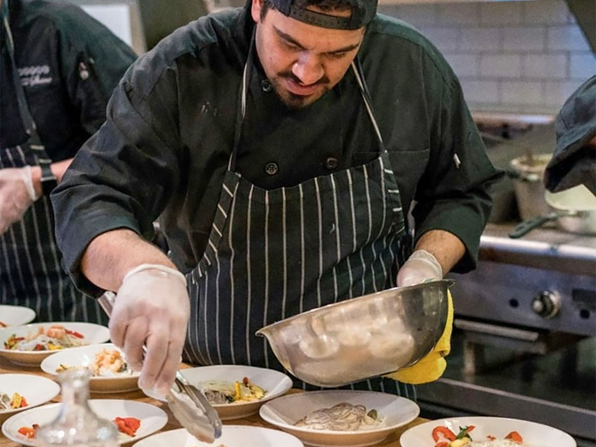 Culinary student preparing food