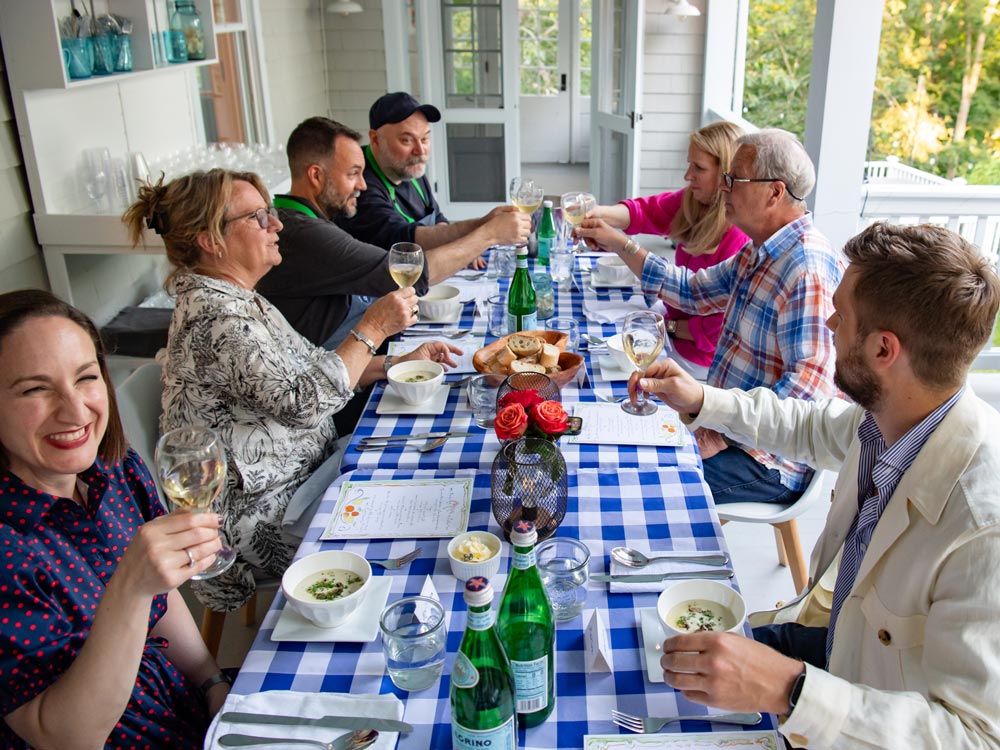 People at a table toasting