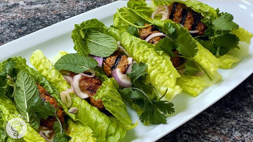 Grilled Merguez on Lettuce with Cilantro, Mint and Pickled Onions