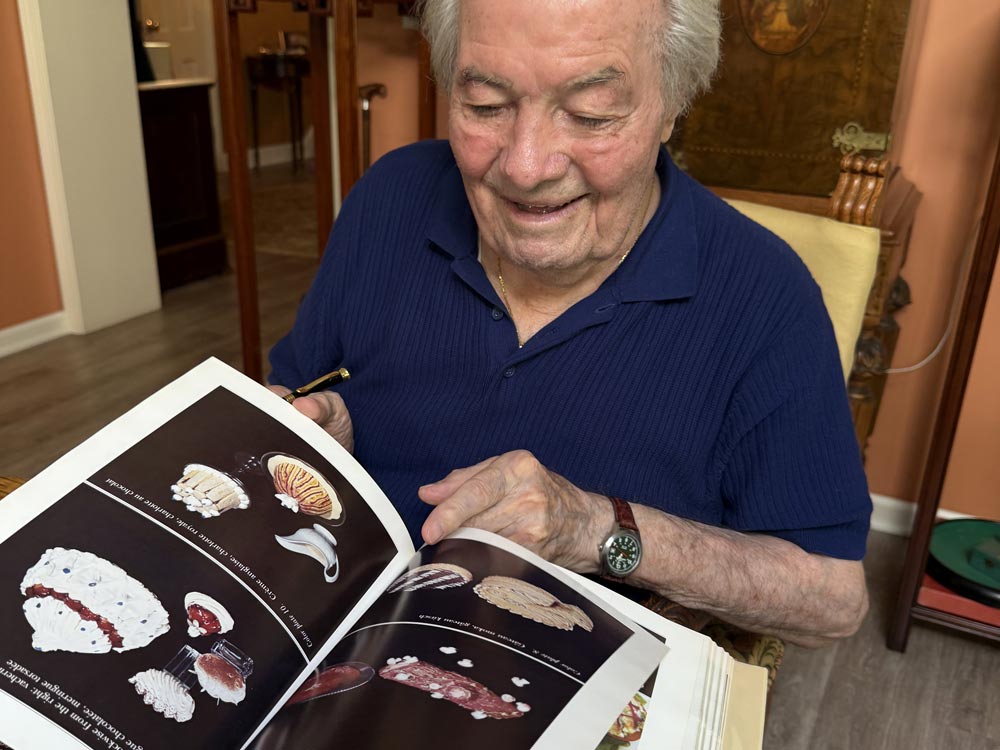 Jacques Pépin looking at a copy of La Technique